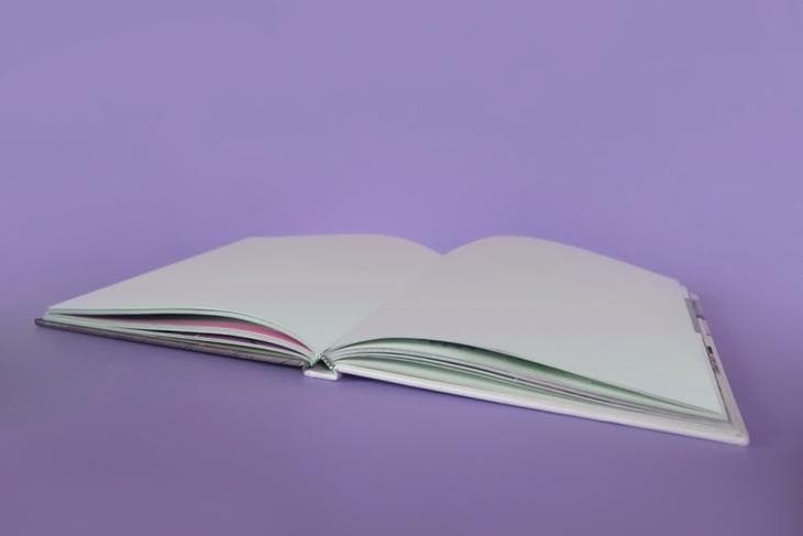 Notebook on a purple background