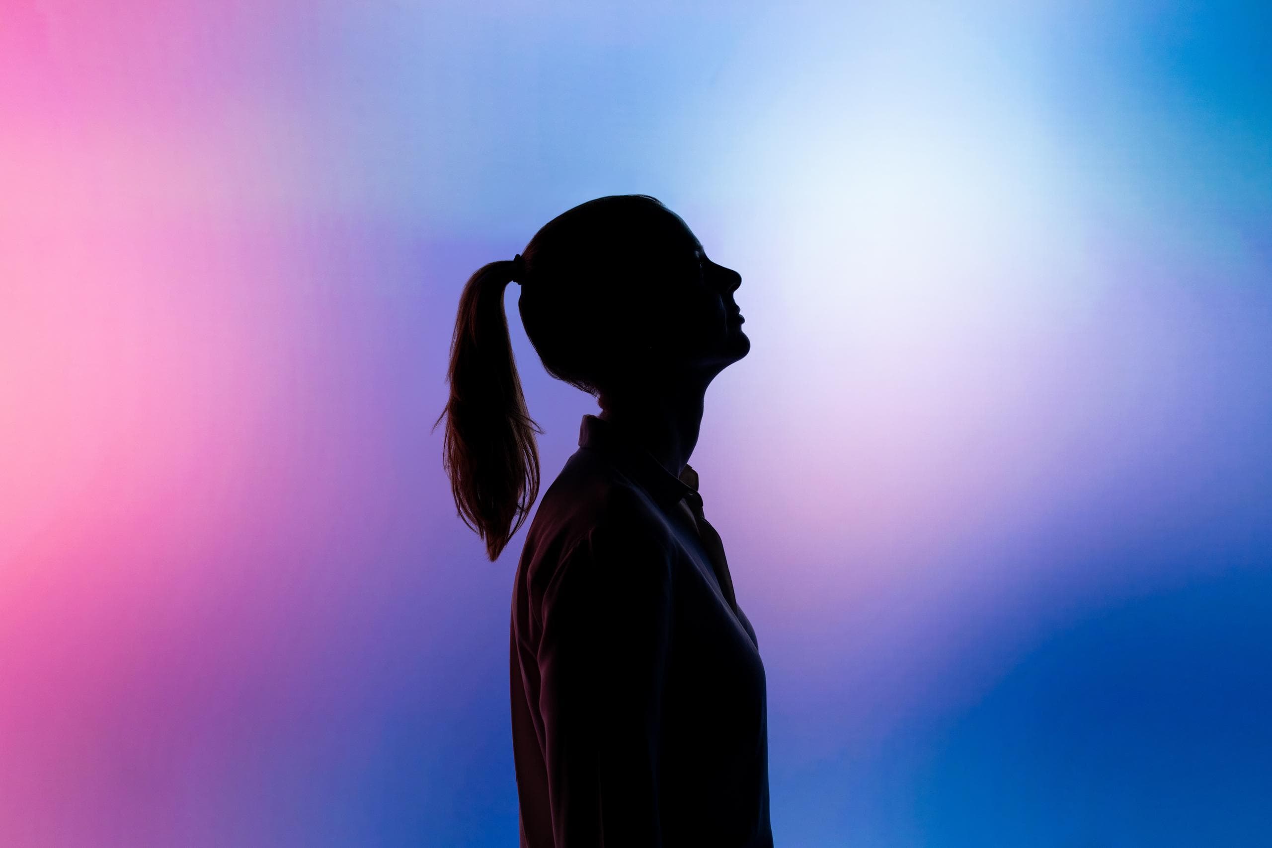 Female software engineer with purple and blue background